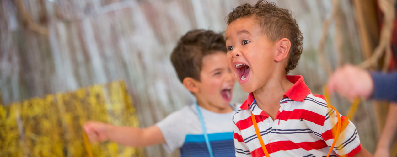 A preschool boy screams, his behavior disrupting his class.