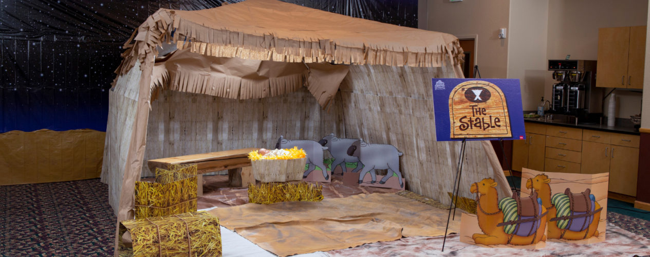 An interactive VBS Bible Museum exhibit. This is a stable, complete with hay.