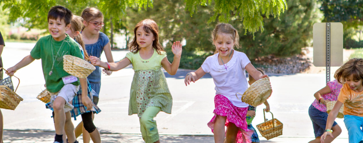 Elementary children start sprinting as an Easter egg hunt begins.