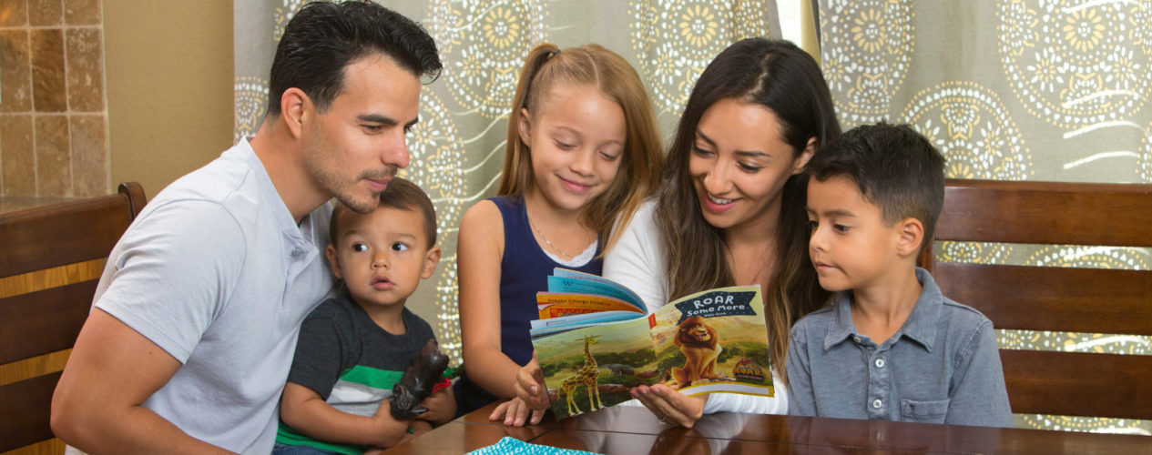 A family is reading a devotion together.