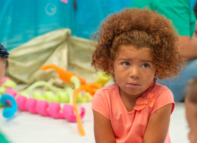 A preschool girl looks sad after she told a lie.