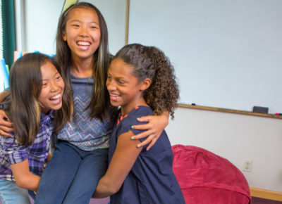 Three preteen girls are playing The Tower of Babel Bible Game