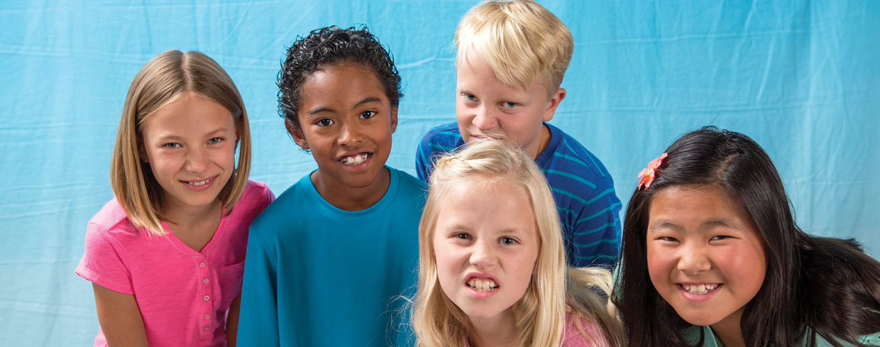 A group of five children snarling at the camera.