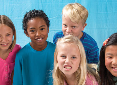 A group of five children snarling at the camera.