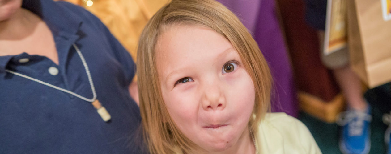 An elementary girl makes a silly face for the camera.