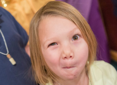 An elementary girl makes a silly face for the camera.