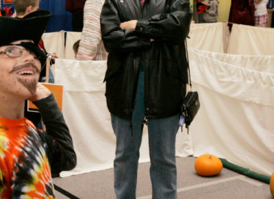 An elementary age boy dressed as a pirate attending a fun pirate-themed event.