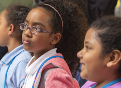 preteens doing an activity in a children's ministry setting