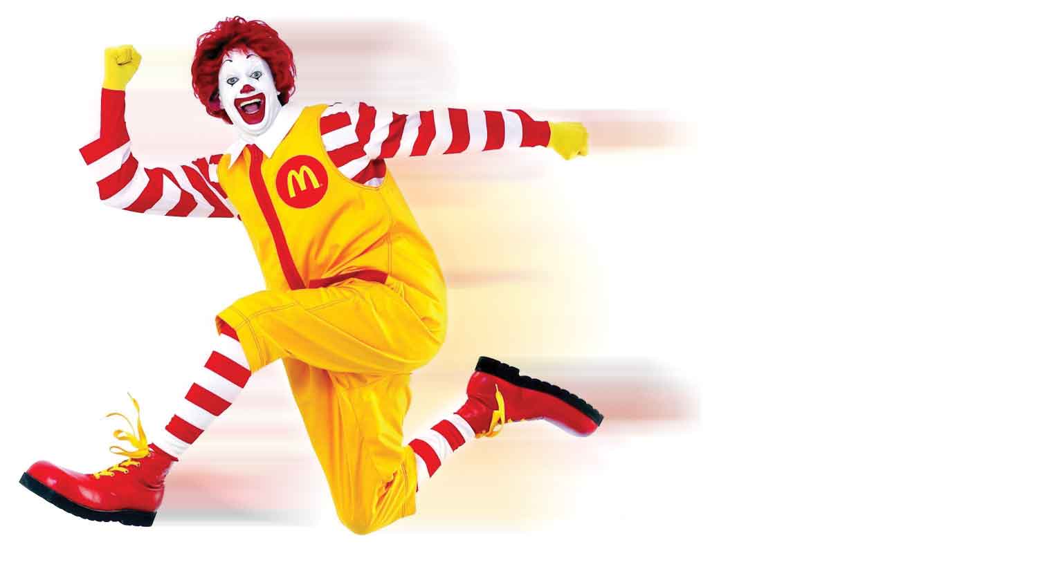 Ronald McDonald sprinting so fast that he is blurry.