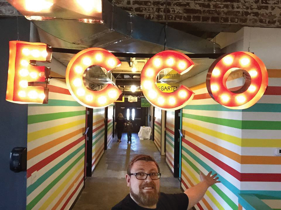 Patrick Black standing in front of an ECCO sign.