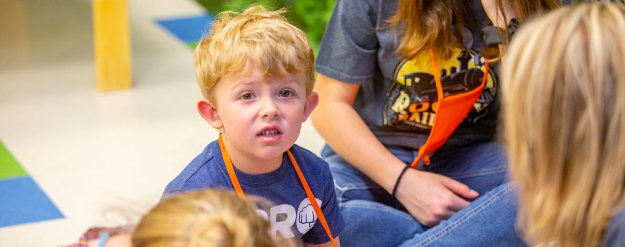 A preschool boy has a sad look on his face as he faces negative consequences.