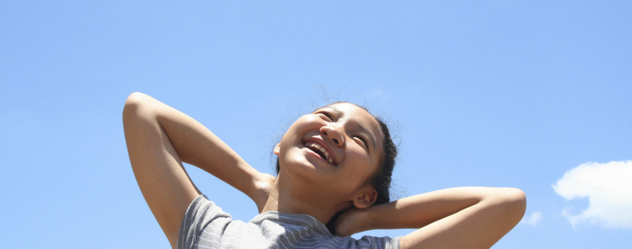 girl looking to sky with new life in Jesus