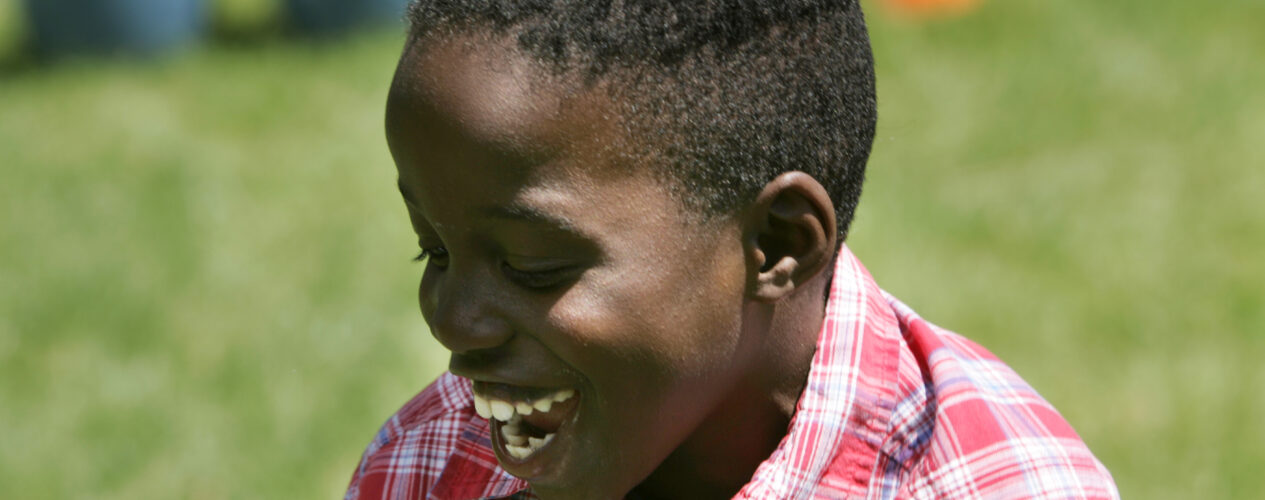 elementary age boy looking joyful