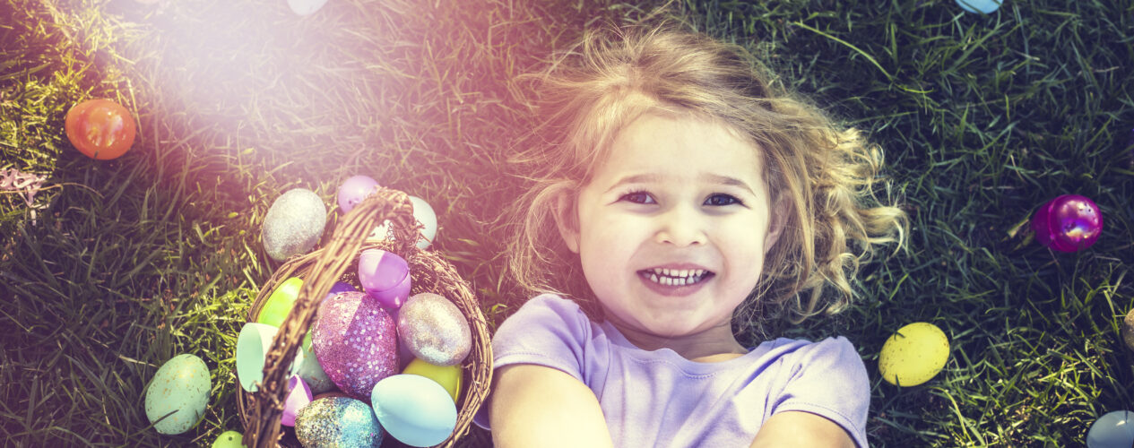 preschool girl smiling with Easter egg basket
