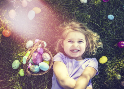preschool girl smiling with Easter egg basket