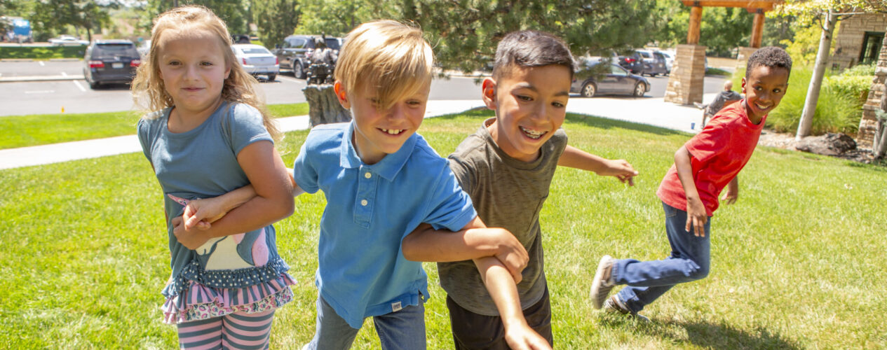 kids playing a fall game outside