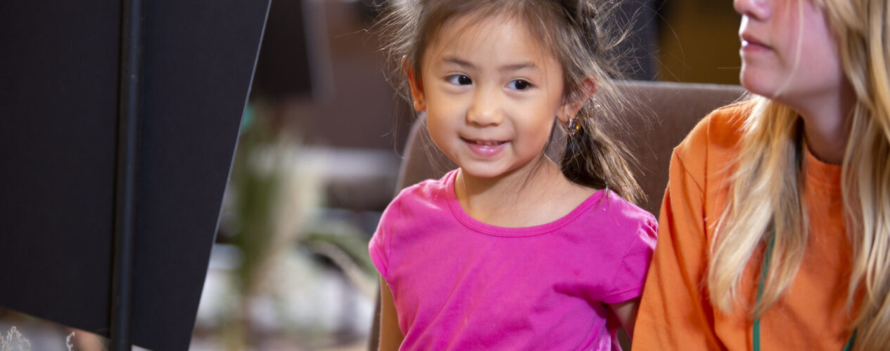 girl sitting in preschool object lesson