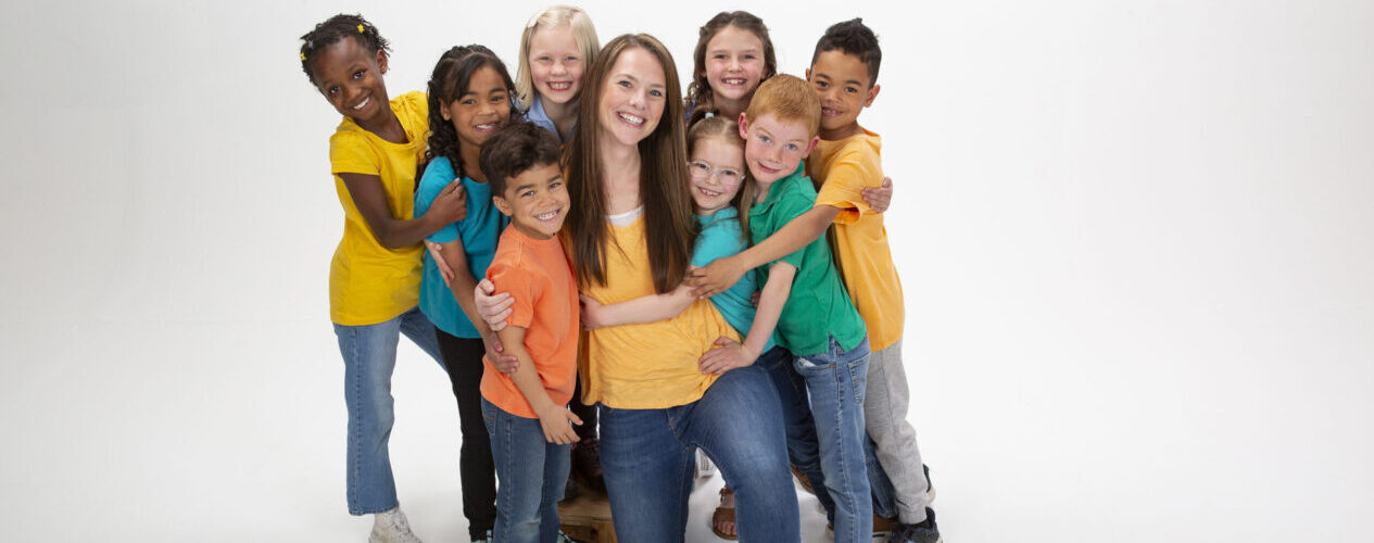 leader and kids smiling for Easter activities