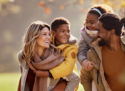 Family of four outside in fall