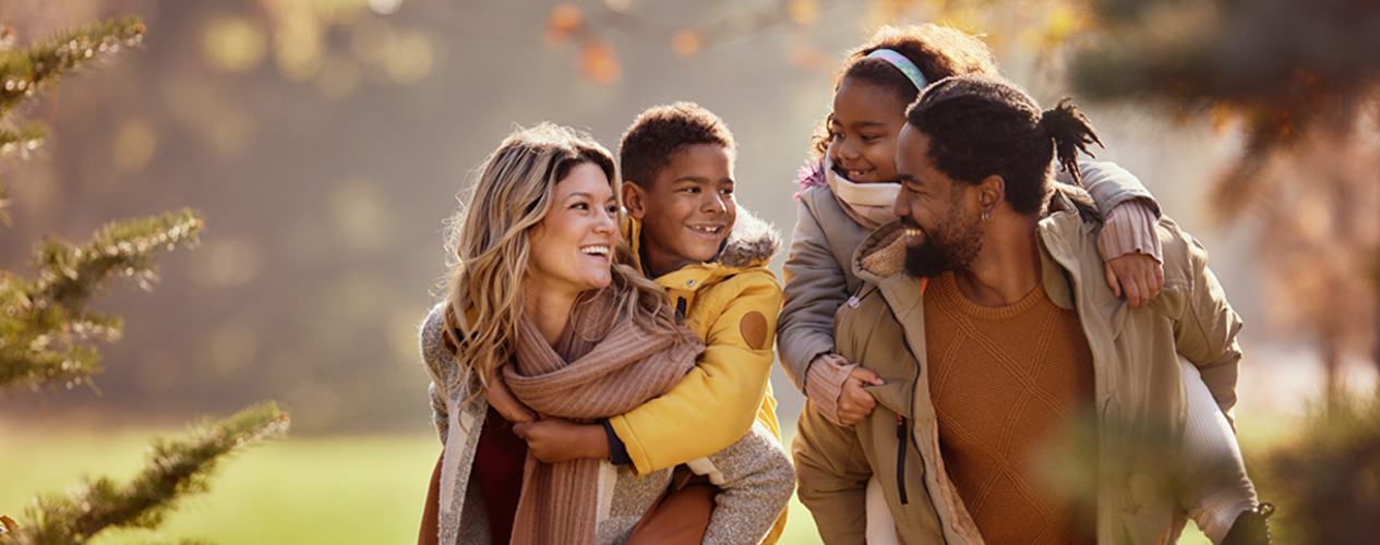 Family of four outside in fall