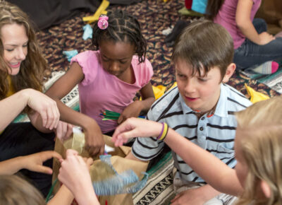 Teacher who knows about inclusivity in children's ministry leading a Bible lesson.