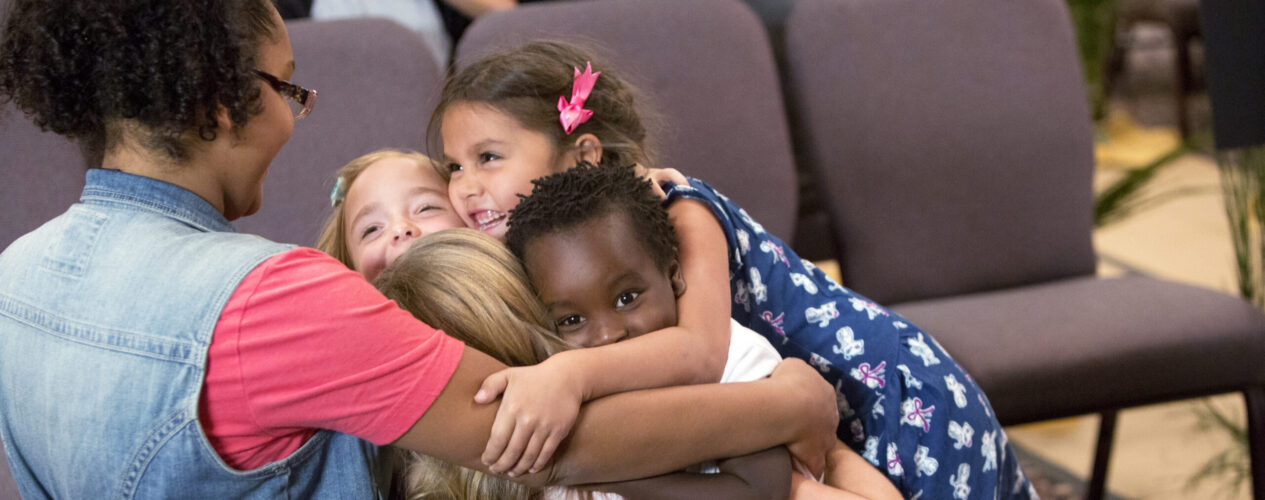 Children's ministry leader who knows how to teach kids about Passover. She tells kids that God cares for them after the London Bridge activity.