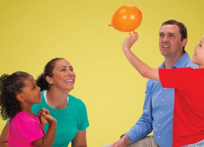 Family playing "Kindness Keep It Up" as a family ministry activity.