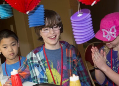 Kids and a leader trying out graduation and promotion ideas for children’s ministry.