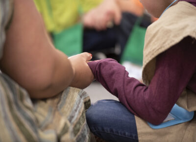 Leader and kid participating in one of the prayer ideas.