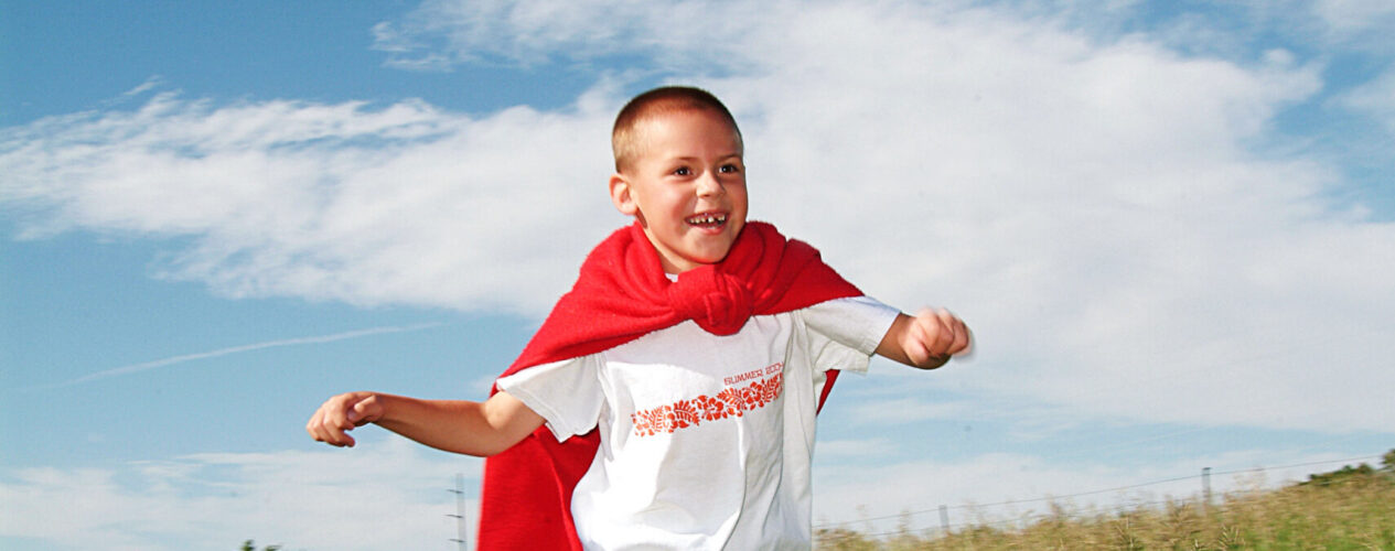 Boy participating in an Independence Day outreach idea.