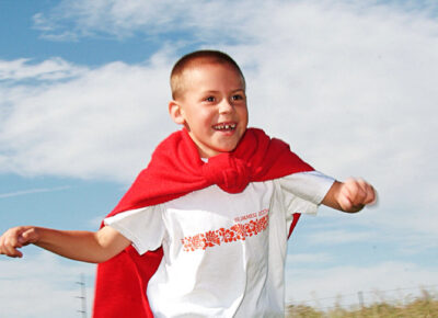 Boy participating in an Independence Day outreach idea.