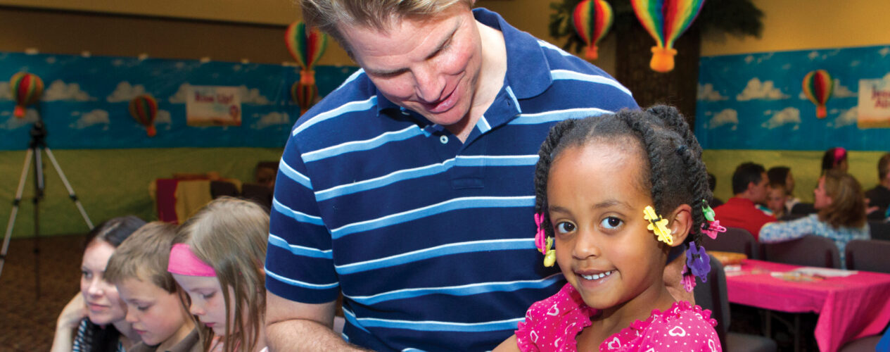 Father and daughter participating in a preschool Father’s Day children’s church lesson