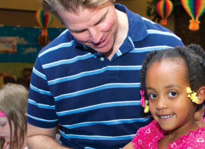 Father and daughter participating in a preschool Father’s Day children’s church lesson