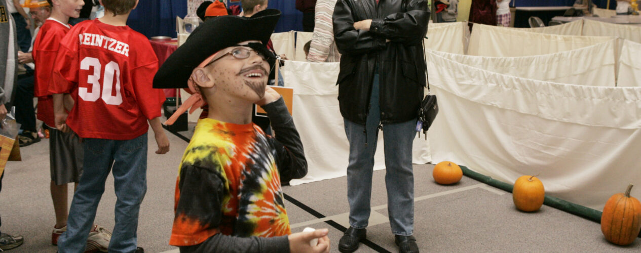 elementary boy playing a Kid’s Ministry Elementary Halloween game