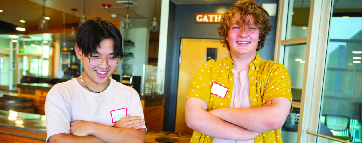 teenage volunteers smiling at the camera