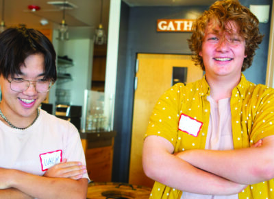 teenage volunteers smiling at the camera